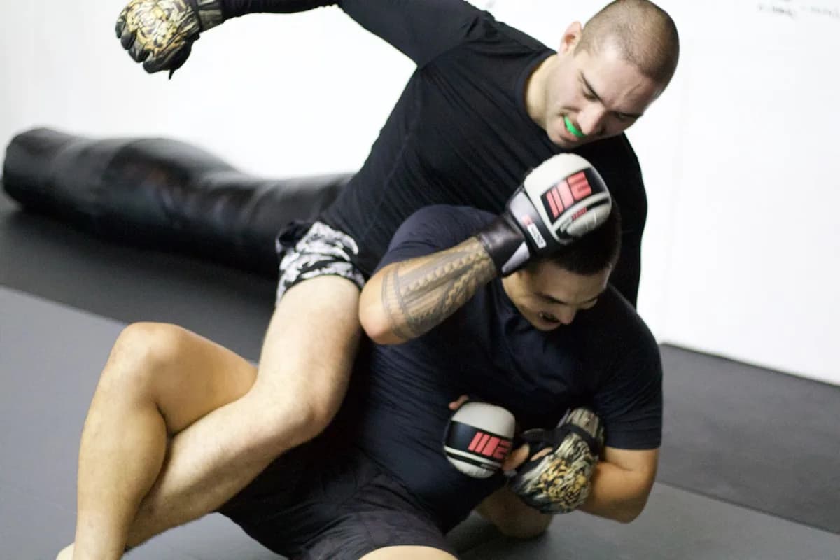 Ground and pound technique in MMA class at Industrial Fitness Queenstown